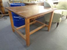 A mid century school laboratory table with under stretcher