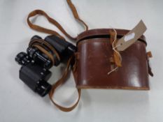 A pair of early twentieth century leather cased field glasses by Wray of London 8 x 30