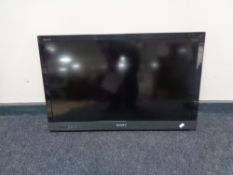 A Sony Bravia KDL-32EX524 LCD TV with lead and remote,