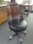 An oil drum swivel office chair