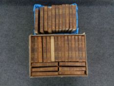A box and a basket of thirty-two early 20th century leather bound volumes of The Encyclopedia