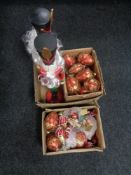 A box of two large wooden Nutcracker figures and assorted Christmas tree decorations