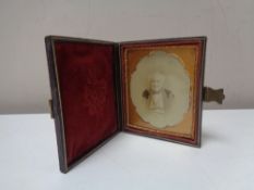 A Victorian daguerreotype portrait of a gentleman in a leather case
