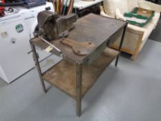 A homemade twentieth century iron framed two tier bench with two drawers together with a bench vice