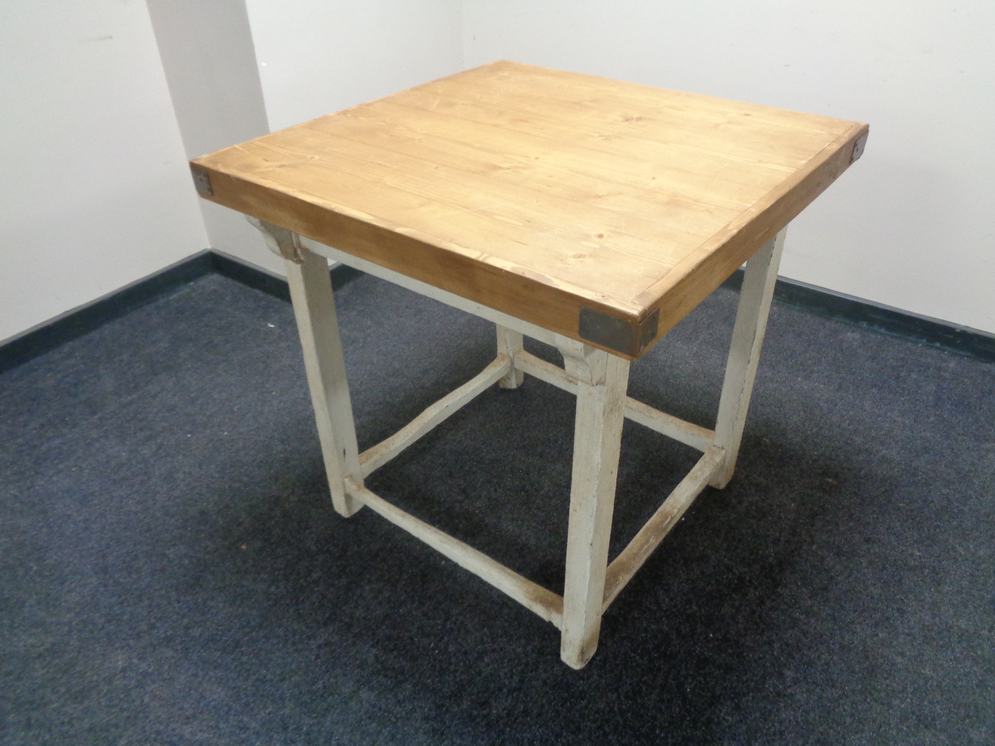 A reclaimed pine butcher's block table on painted base