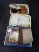 Three crates of assorted table linen, woolen rug, lady's hats,