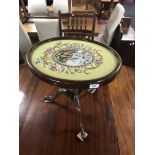 A 19th century mahogany pedestal wine table with tapestry panel top