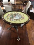 A 19th century mahogany pedestal wine table with tapestry panel top