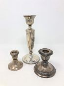 Three silver candlesticks,