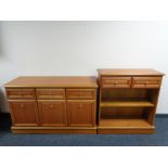 A contemporary teak sideboard with matching bookshelves