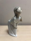 A Lladro figure of a girl in night dress