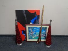 Two red glass and metal Christmas tree decorations together with a replica rifle,