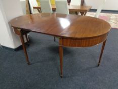 A Victorian mahogany D-end dining table with leaf