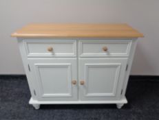 A painted pine double door sideboard fitted two drawers