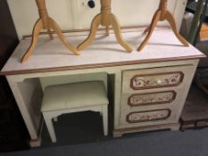 A contemporary painted three drawer pedestal desk together with similar footstool