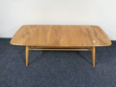 An Ercol solid elm and beech occasional coffee table with undershelf, catalogue no.