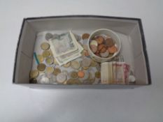 A box of foreign bank notes, coins,