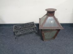 A wrought iron trivet together with an antique metal and glass lantern (glass a/f)