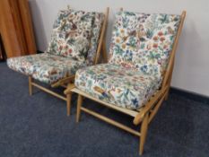 A pair of Ercol solid elm and beech easy chairs, catalogue no.