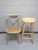 An oak breakfast bar stool together with a painted bentwood chair with rattan seat