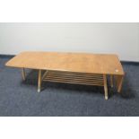 An Ercol elm and beech flap-sided coffee table with undershelf, length 104cm, 160cm extended,