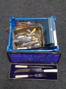 A basket of plated and stainless steel table cutlery, cased three piece carving set,