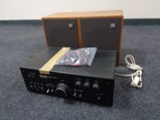 A Solarvox model SA2020 stereo amplifier together with a pair of Wharfedale teak cased speakers