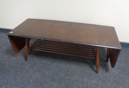 An Ercol stained elm and beech flap sided coffee table with undershelf, catalogue no.