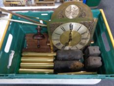 A box of teak and later clock weights, Tempus Fugit clock face, pendulum parts,