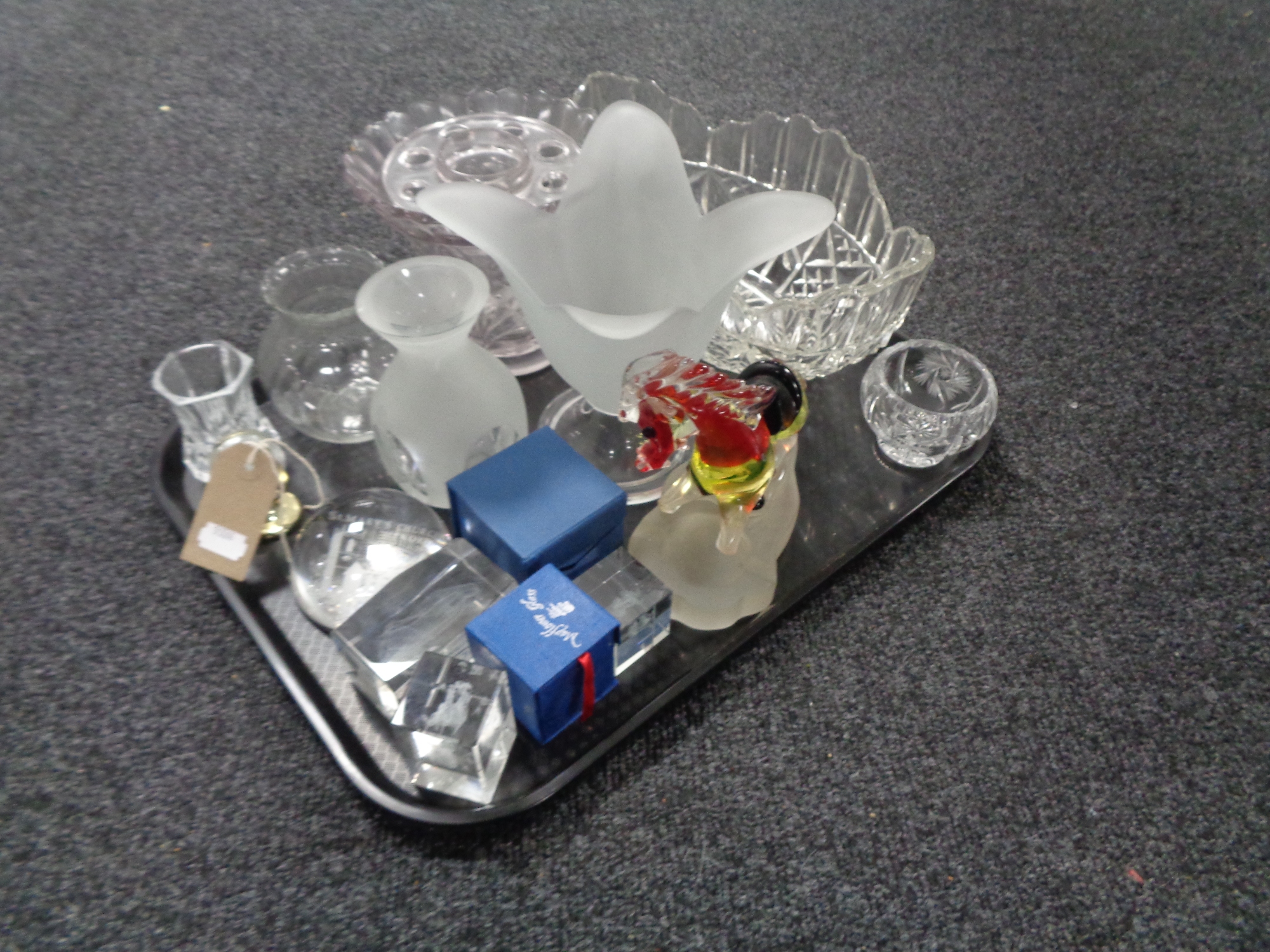 A tray of glass, paperweights, coloured glass horse ashtray,