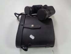 A pair of cased Prinz Lux 10 x 50 binoculars