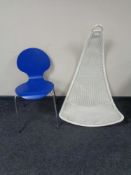 A 20th century wicker hanging chair together with a contemporary blue dining chair on metal legs