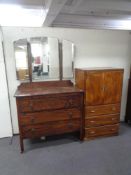 A 1930's three drawer oak chest with hall mirror and stained plywood linen chest