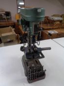 A Nutool five speed drill press with drill bits and accessories