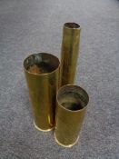 Three brass ammunition shells