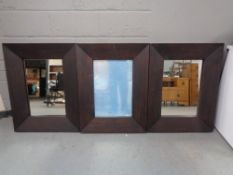 Three wooden framed contemporary wall mirrors (two with loose glass)