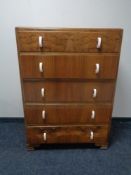 A 1930's walnut five drawer chest