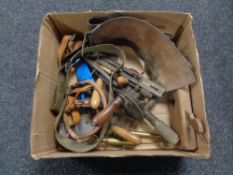 A box containing vintage hand tools to include woodworking plane, egg whisk, hand drill,