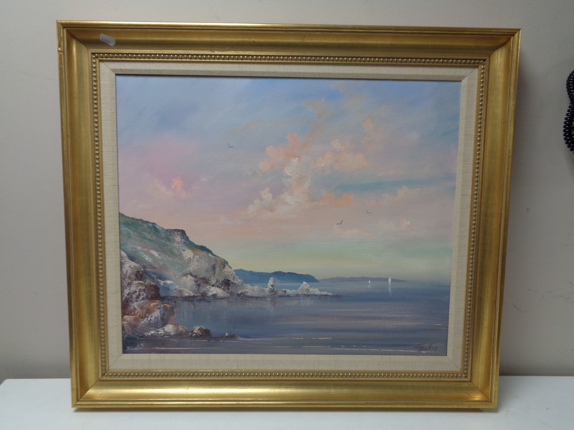 A 20th century gilt framed oil on canvas, coastal landscape,