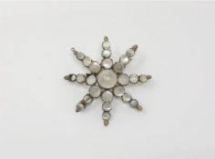 An antique moonstone costume brooch (three stone missing)