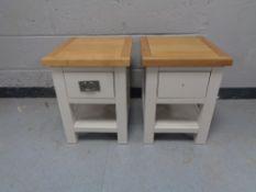 A pair of contemporary oak topped bedside tables on painted bases with drawer and undershelf (one
