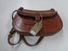 A vintage brown leather satchel bag