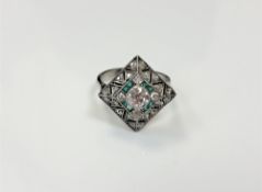 A white gold Art Deco style emerald and diamond ring,