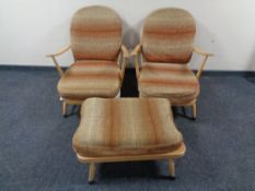 A pair of Ercol solid elm and beech Windsor double-bow easy chairs, catalogue no.