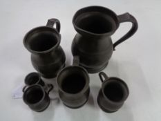 Six antique pewter tankards/measures