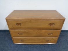 An Ercol solid elm three drawer chest, catalogue no.