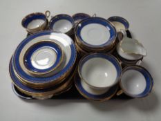 A tray of two part blue and gilt china tea services, Old Royal china,