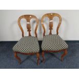 A pair of Victorian mahogany dining chairs on cabriole legs