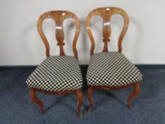 A pair of Victorian mahogany dining chairs on cabriole legs