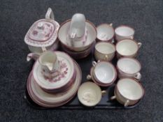 An antique pink lustre thirty-seven piece tea service